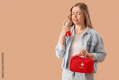 Sick young woman with first...