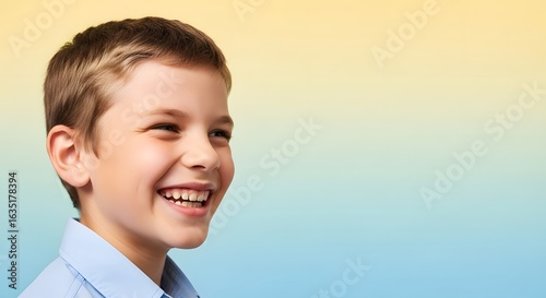 Boy making big goofy smile, moderate silliness, side profile, high key light, medium shot, gradient backdrop.
