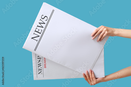 Female hands with blank new...