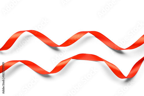 Curled red satin ribbons on...