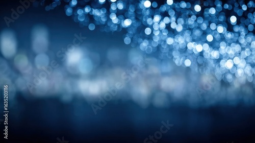 Blurred blue bokeh lights creating a festive and magical atmosphere, perfect for holiday or celebration backgrounds