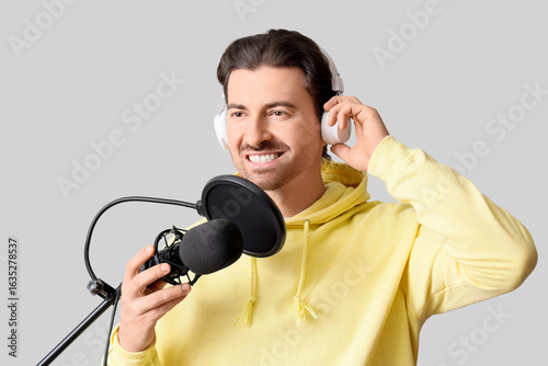 Male radio presenter with m...