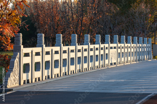 The bridge over the lake in autumn