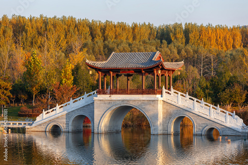 The bridge over the lake in autumn
