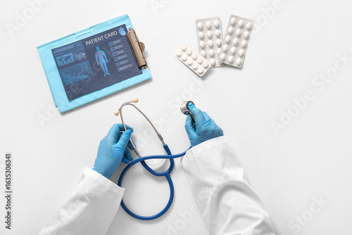 Doctor with stethoscope, pa...