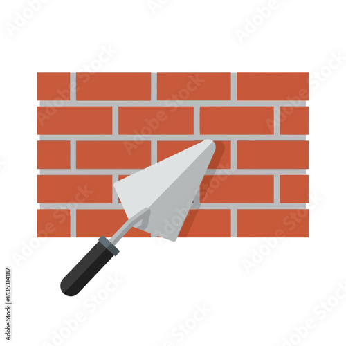 Brick wall with a trowel applying mortar construction building.