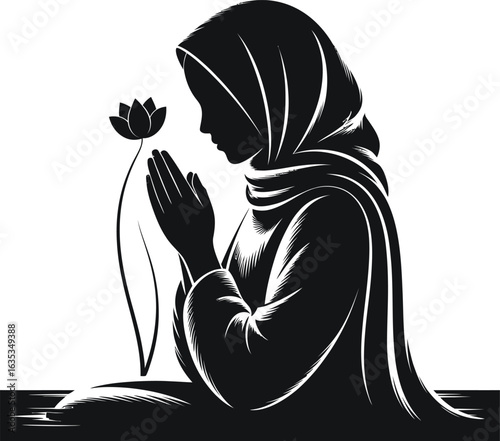 Silhouette of a woman in a hijab praying with a flower