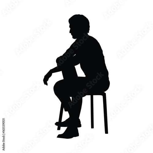 Silhouette of a Seated Man Pondering While Resting on a Chair