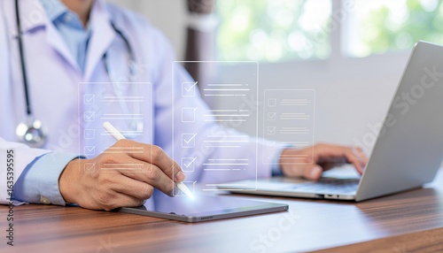 Modern doctor efficiently completing digital medical checklist on tablet with laptop support system