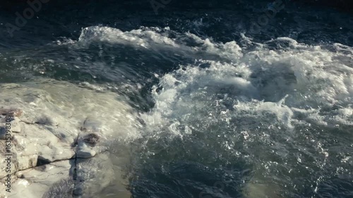 A small stream rushing over rocks