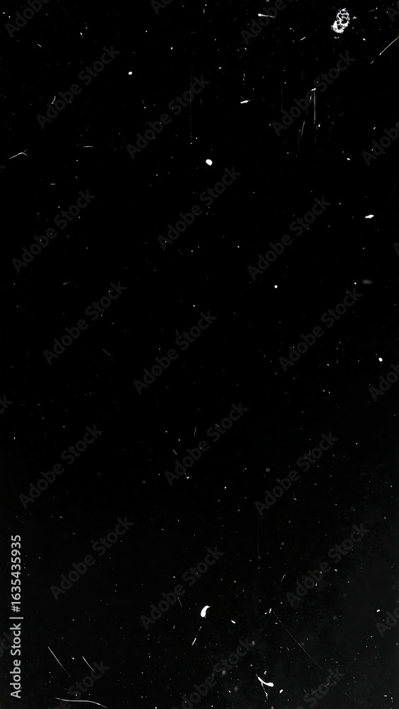 Fototapeta premium Dark background with scattered light dust and scratches