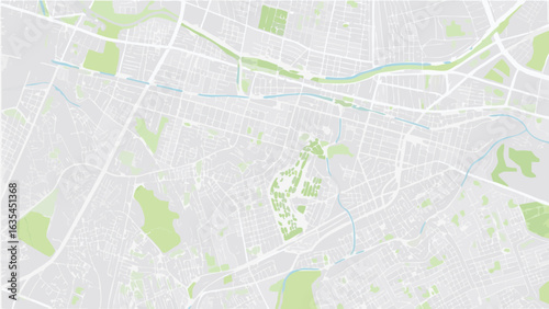 Vector aerial view of a city map with parks, rivers, and street grid in a light color palette displaying urban layout