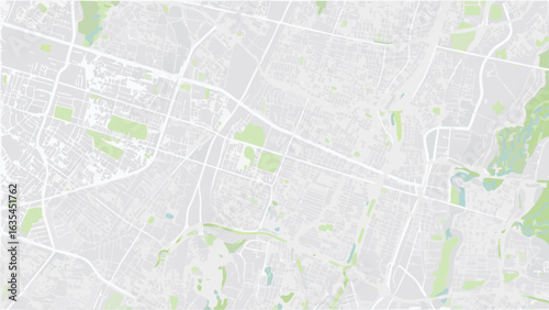 Vector aerial view of a city map with light gray roads and green spaces creating an abstract pattern design