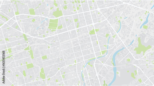 Vector aerial view of a city map with river, green spaces, and a grid of streets in a light color scheme