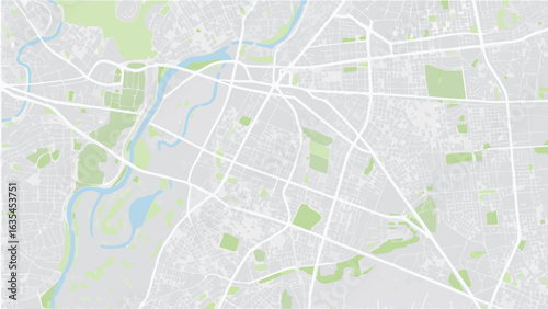 Vector overhead view of a city map with roads rivers and green spaces in a light color palette showing urban layout