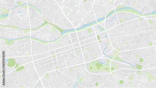Vector aerial view of a city map featuring a river and parks with a grid like street layout and buildings
