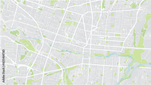 Vector aerial view of a city map with streets, parks, and a river flowing through the urban landscape view