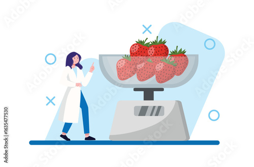 Strawberries on Scale with Woman in Lab Coat Pointing