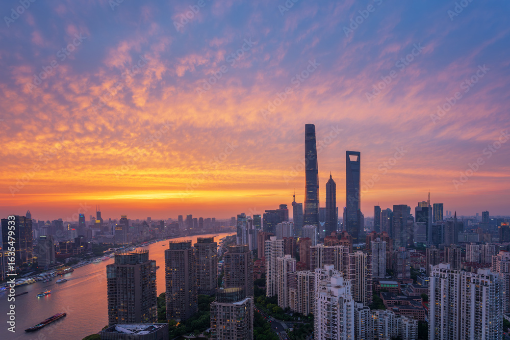 Fototapeta premium Overlooking Shanghai Lujiazui skyscrapers at golden dusk