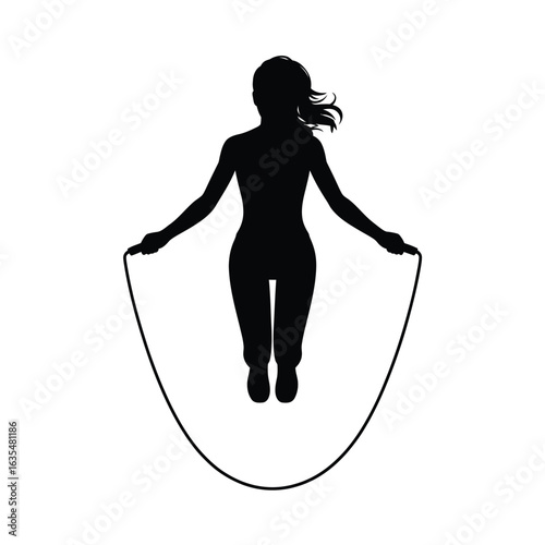 Silhouette of a woman jumping rope in mid air