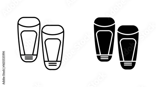 Line art and solid black icons:  a pair of modern, minimalist shin guards for sports or protective gear.