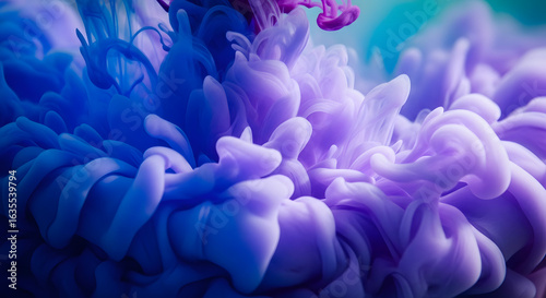 Fluid Dance of Color: A mesmerizing macro photograph showcasing a vibrant dance of swirling blue and purple ink suspended in liquid, creating a surreal and abstract visual experience.