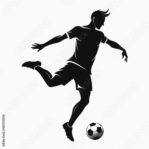 Silhouette of a soccer player kicking a ball