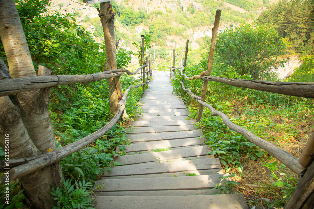 Fototapeta premium Wooden stairs in outdoor. Summer. Armenia