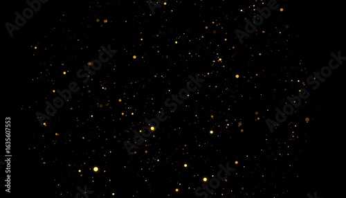 Golden dust particles scattered on a black background