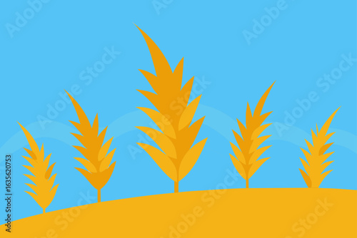 Golden wheat stalks against a bright blue sky