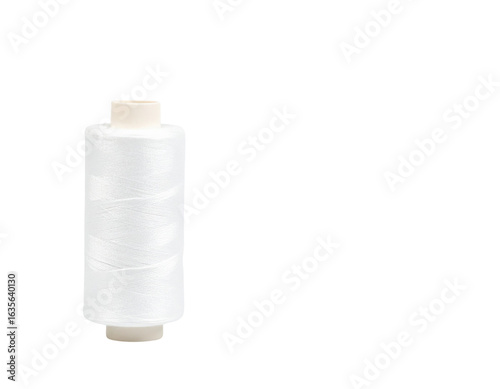 A white spool of thread with a smooth texture, commonly used for sewing and crafting.