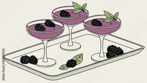 Three dessert glasses with purple filling and blackberries on a tray with additional blackberries