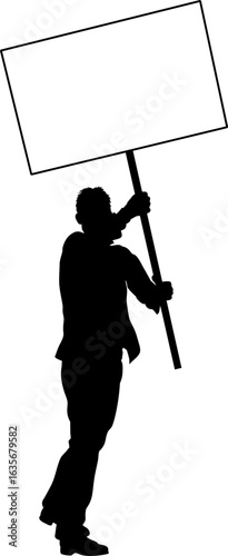 Protestor or demonstrator at a demonstration march, picket line or strike protest rally in silhouette. Holding up a banner or picket sign board placard.
