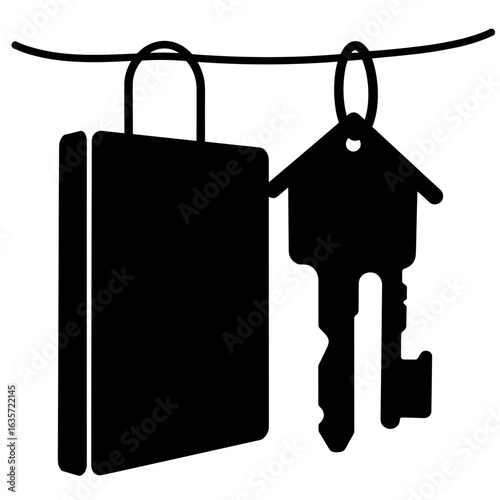 Home key silhouette with binder on ring, metaphor for property insurance and ownership security