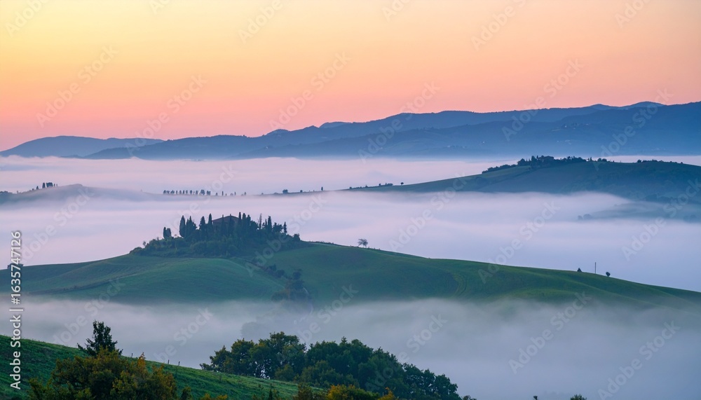 Fototapeta premium Serene Sunrise Over the Rolling Hills of Italy with Mist. Foggy Morning in Tuscany with Farmhouse and Cypress Trees
