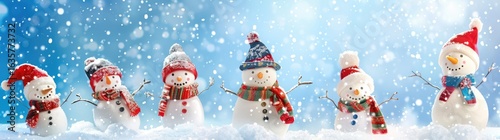 Four funny cheerful snowmen standing in winter Christmas landscape. Merry Christmas and happy New Year greeting card with copy-space. Winter background