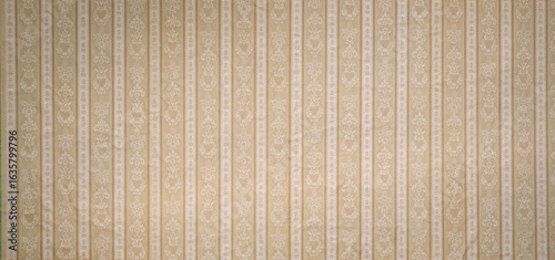 Old wallpaper on the wall. Old wallpaper for texture or background.