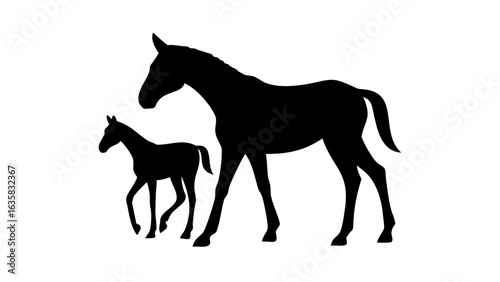 Silhouette of a mare and foal standing together in a field on a bright sunny day in the country side