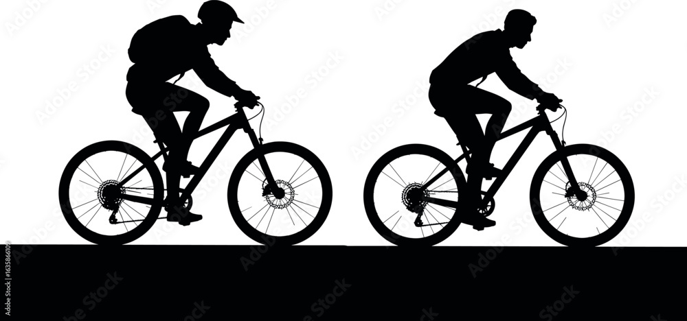 Obraz premium Silhouetted cyclists in action riding mountain bikes on a trail during the day