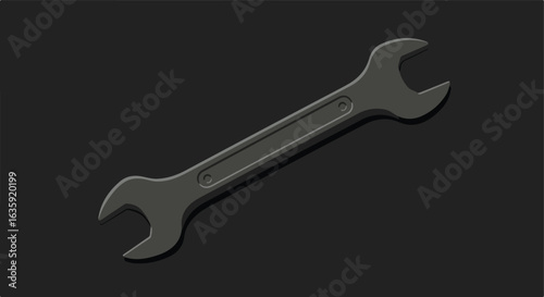 Gray spanner on plain black background, illustrating mechanical tool's utility
