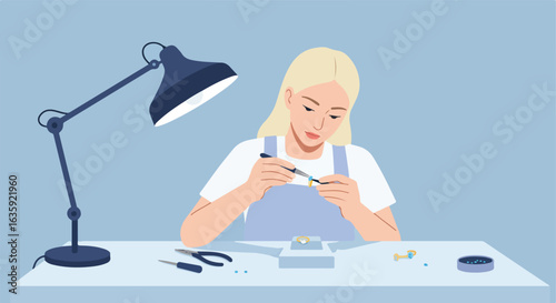 Jeweler delicately setting stone in ring, under the light of a desk lamp