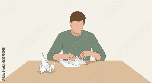 Person making paper origami figures on a wooden desk in a neutral room