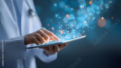 Doctor using tablet with futuristic medical icons and glowing particles