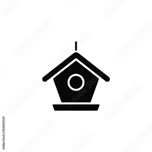 Simple black icon of a birdhouse with a round entrance