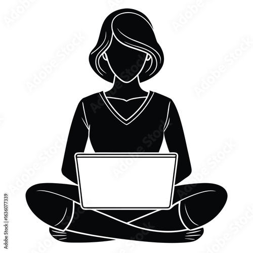 Silhouette of a businessman in a suit working on a laptop
