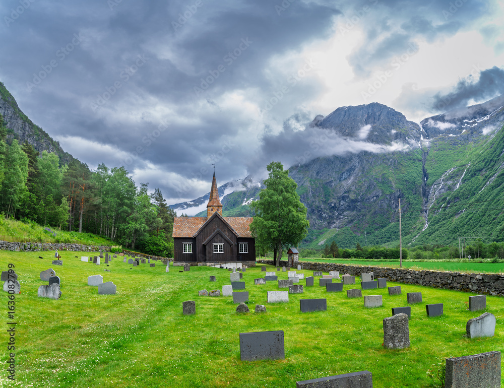 Fototapeta premium small church surrounded by graves