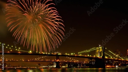 Fireworks Over Cityscape and Bridge at Night — 4K HD Video Footage Download, Vibrant Explosions, City Lights Reflections in Water, Dramatic Long Exposure