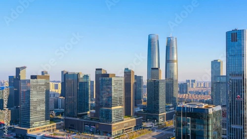 Cityscape with Modern Skyscrapers and Futuristic Glass Towers Under Blue Sky on a Sunny Day — 4K HD Video Footage Download, Wide Angle View, Ultra Detailed