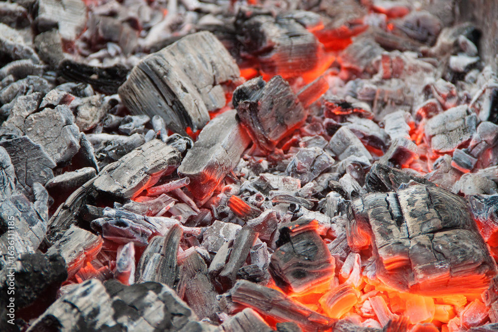 Photo of hot coals. texture of coals on the grill. Edge in the grill Photo of hot coals. texture of coals on the grill. Edge in the grill