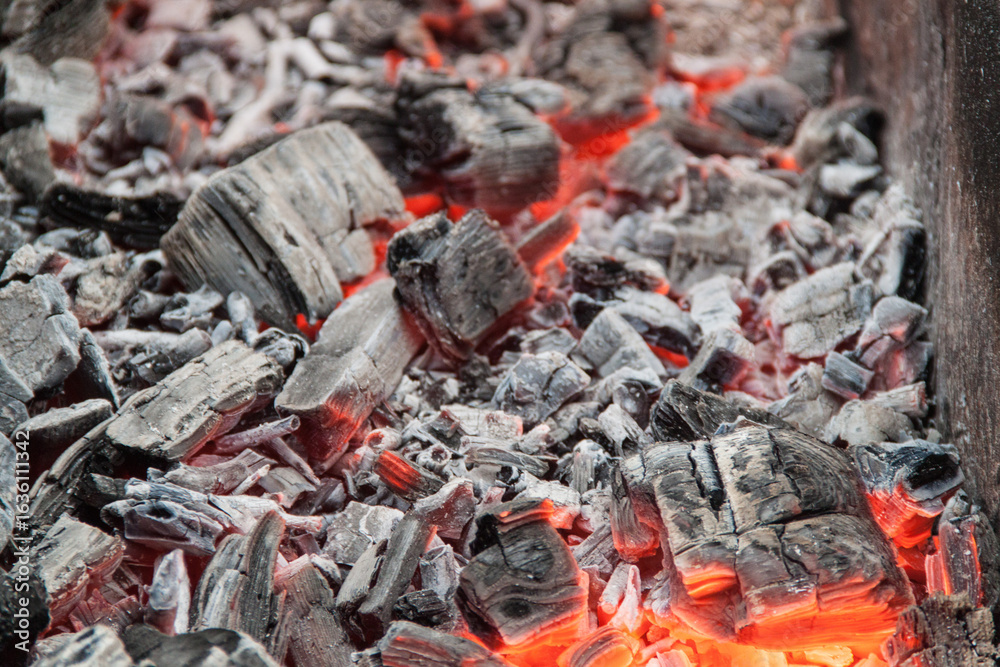 Photo of hot coals. texture of coals on the grill. Edge in the grill Photo of hot coals. texture of coals on the grill. Edge in the grill